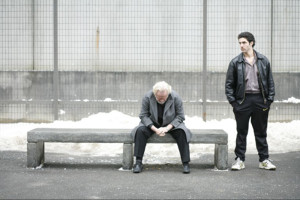 Malik El Djebena (Tahar Rahim) stands beside César Luciani (Niels Arestrup) in the yard of the French prison where they are incarcerated. Courtesy of Sony Pictures Classics.