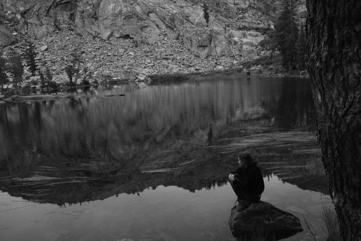 Perched atop a rock, Isabel Langen (13) ponders a Yosemite lake on Sept. 11.