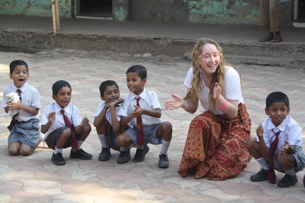 Aideen Murphy (14) teaches Duck, Duck, Goose to children from a Mumbai school run by Teach for India fellows. Urban students visited the school in Dec. to understand how different problems, such as education, are being addressed in India. 
