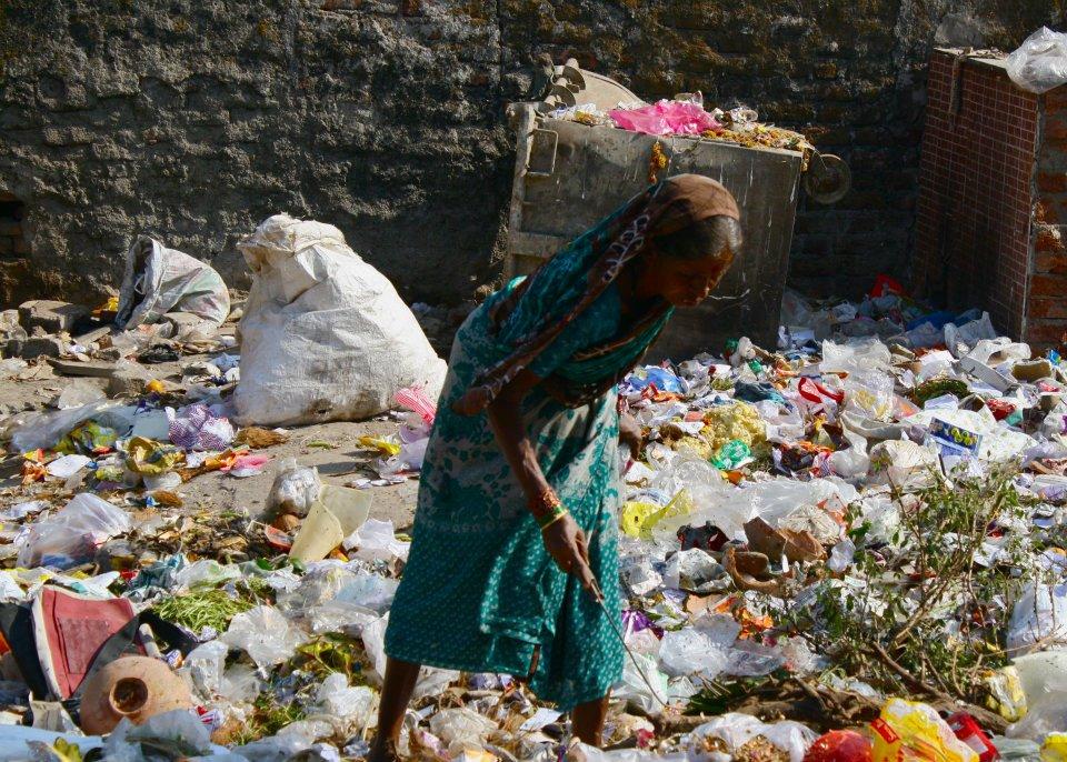 A common scene throughout the trip: This woman rummages through trash thrown by the wayside in Mumbai, in hopes of finding discarded food. The majority of trash in the country is not collected by sanitation companies or deposited in landfills, leading to the spread of diseases such as tuberculosis. We saw many heaps of burning rubbish in front of stores and shacks; we saw a cow nibbling on burnt trash in Pune. In January 2011, researchers at Princeton, Adelaide, and Harvard universities and University of Singapore published a study ranking India as the 7th most environmentally hazardous country in the world.