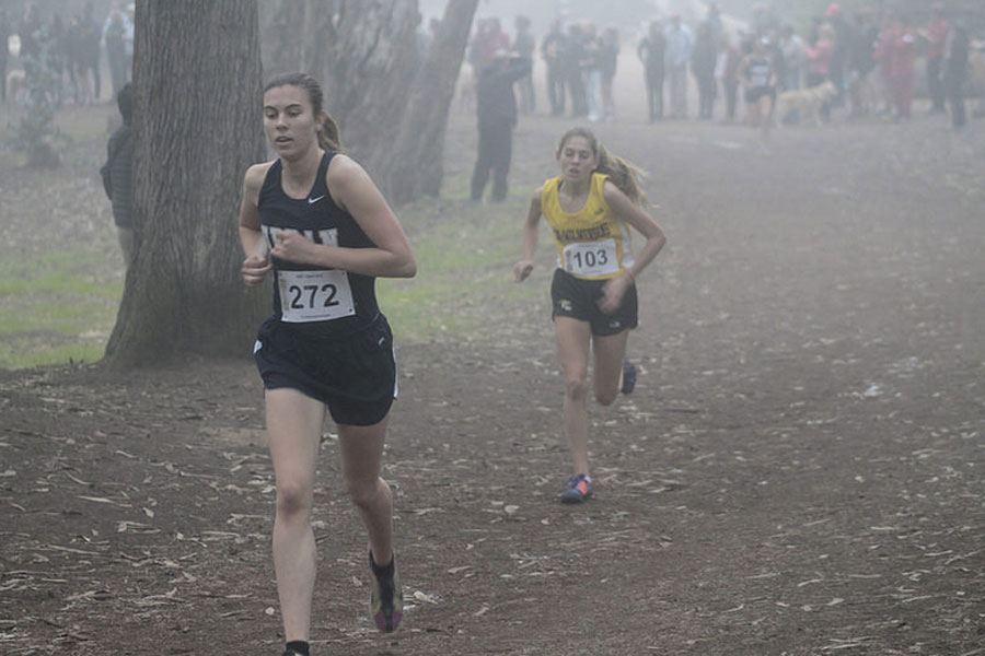 All-leauge first team runner Molly Carleton (15)  leading the way.