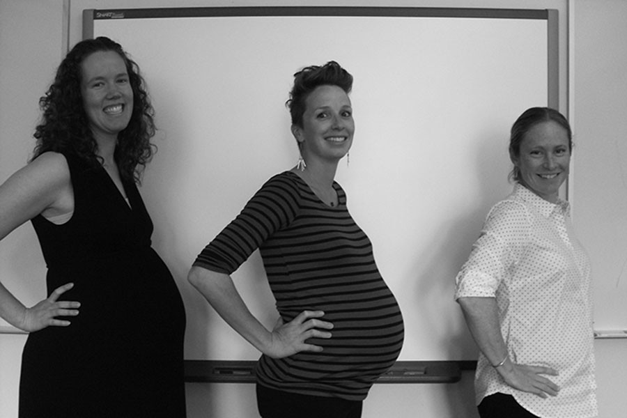 Laura Hawkins, Raina Mast, and Sarah Clowes show off their baby bellies.
