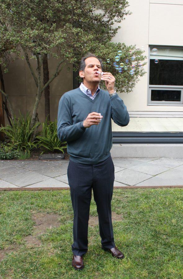 Mark Salkind, blowing bubbles in the Page street backyard. February 2015.