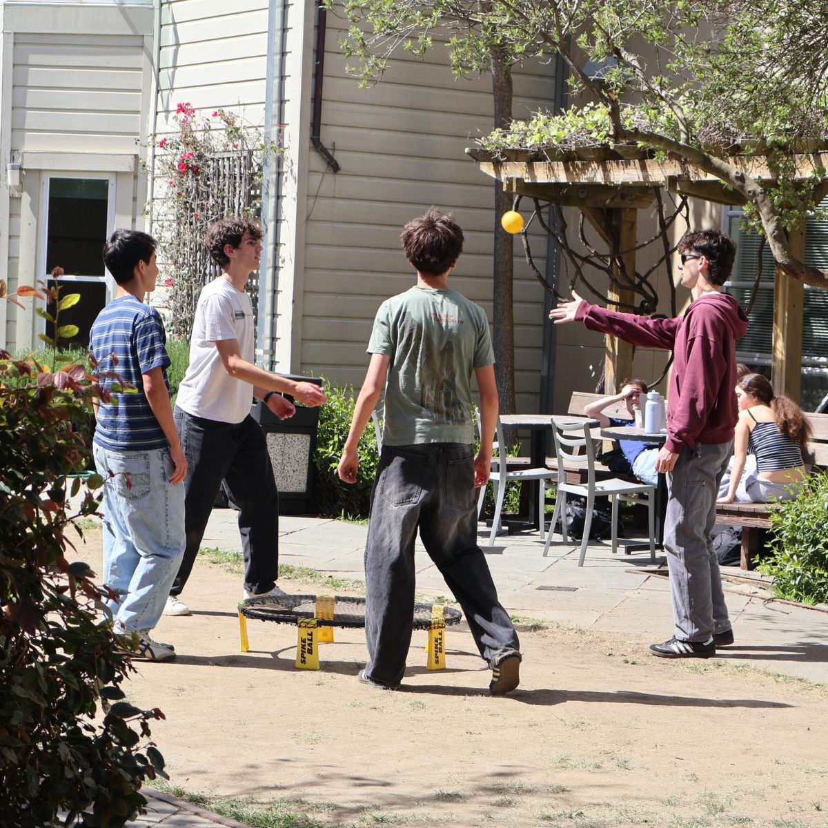 Urban students playing spikeball in the garden on March 26. Photo credit: Kaya Downs.